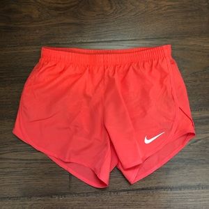 Nike running shorts neon orange pink